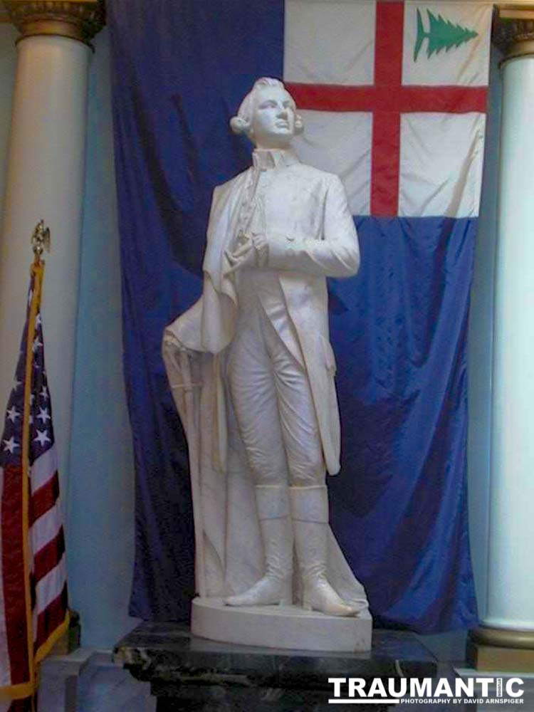 A marble statue of a revolutionary war figure