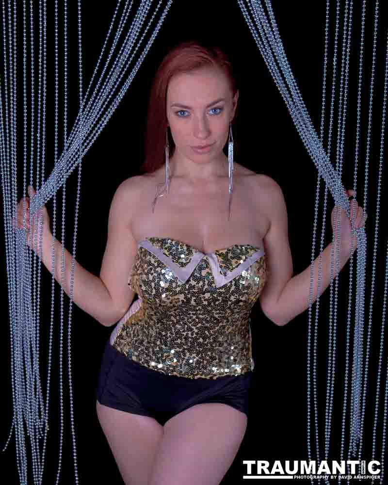 Playboy Cover Model Titania Lyn and a beaded curtain