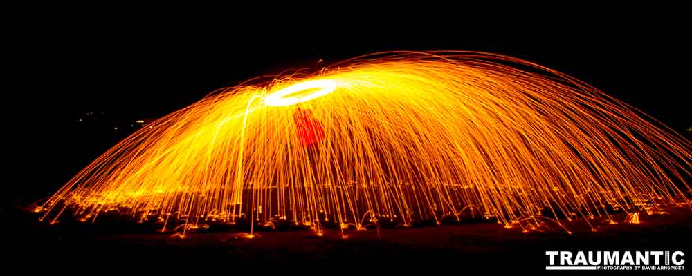 Steel wool ignited, spun  and captured in long exposure.