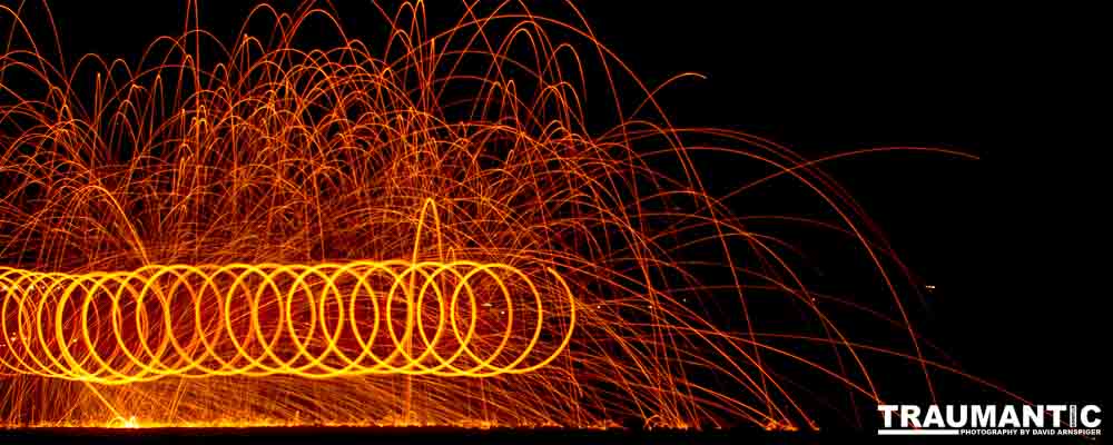 Steel wool ignited, spun  and captured in long exposure.