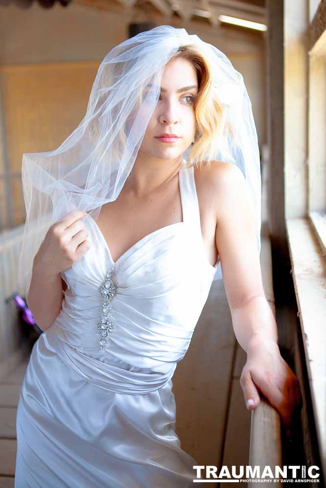 Cowgirl brides in the mid-day sun at an old church.