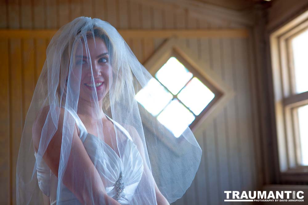 Cowgirl brides in the mid-day sun at an old church.