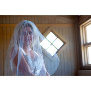 Cowgirl brides in the mid-day sun at an old church.