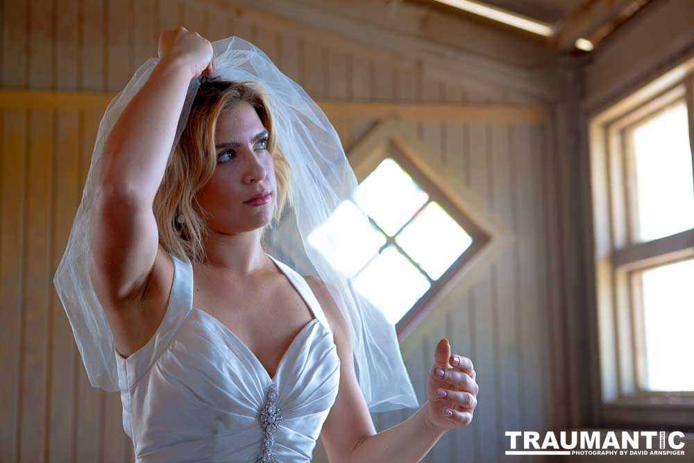 Cowgirl brides in the mid-day sun at an old church.