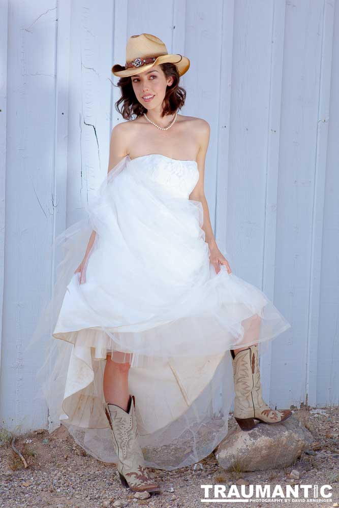 Cowgirl brides in the mid-day sun at an old church.