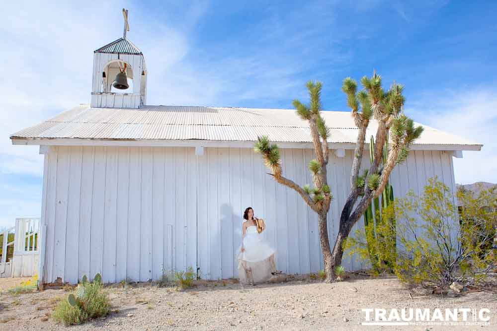 Cowgirl brides in the mid-day sun at an old church.