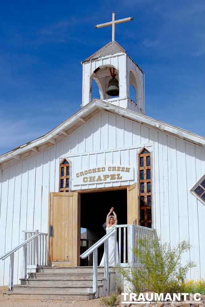 Cowgirl brides in the mid-day sun at an old church.