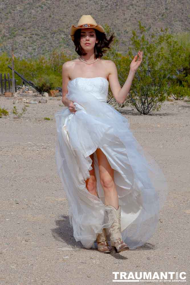 Cowgirl brides in the mid-day sun at an old church.