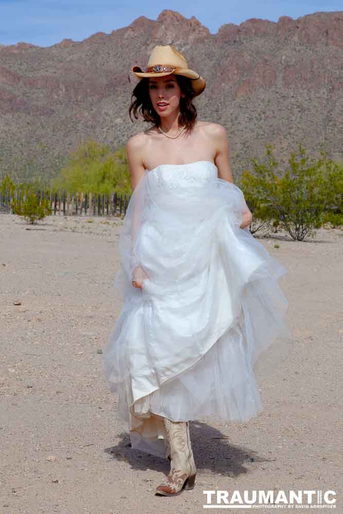 Cowgirl brides in the mid-day sun at an old church.